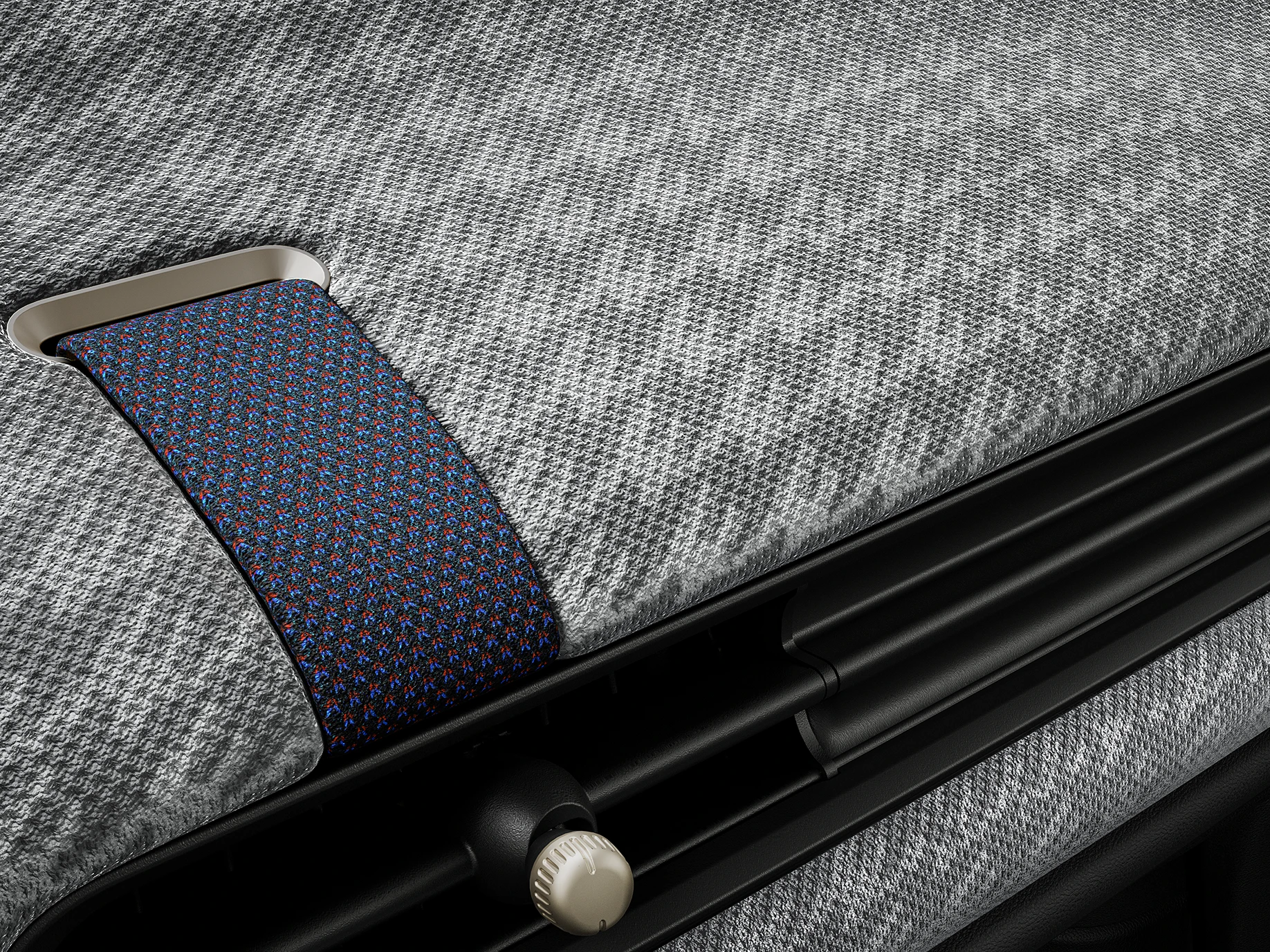 Pohľad zblízka na 2D-pletenú palubnú dosku vo vnútri MINI Cooper.