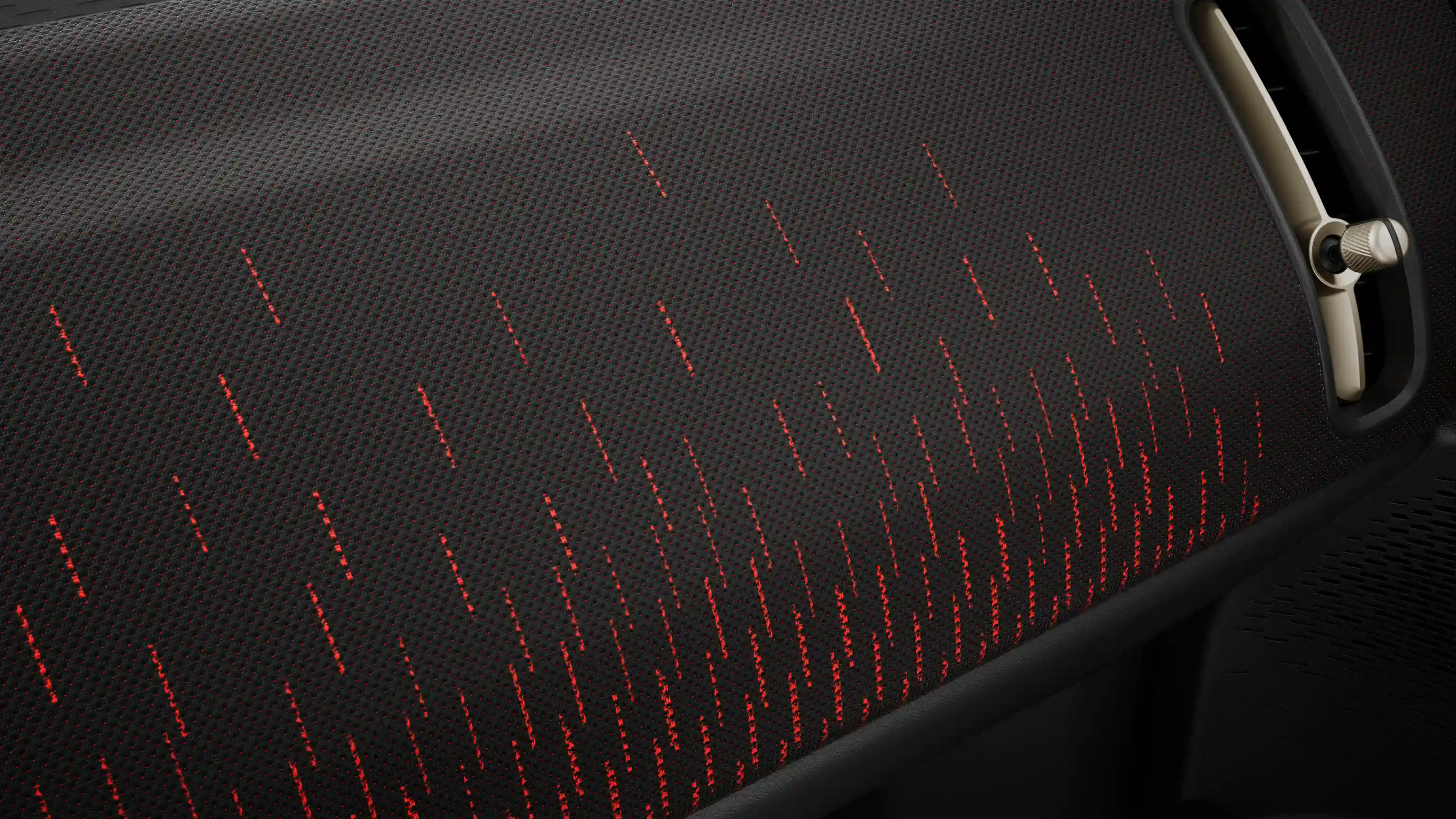 Pohľad na červeno čiernu palubnú dosku čisto elektrického MINI Countryman v štýle JCW