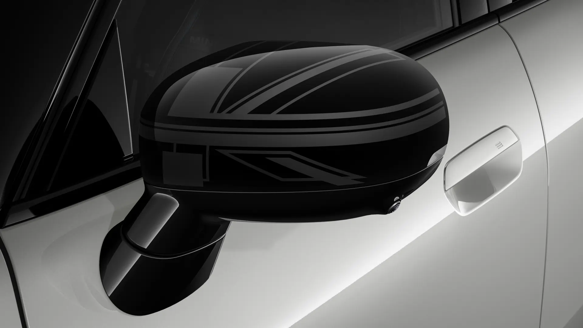 MINI Cooper 3-dverové v striebornej farbe s dizajnom Night Union Jack na vonkajších zrkadlách.