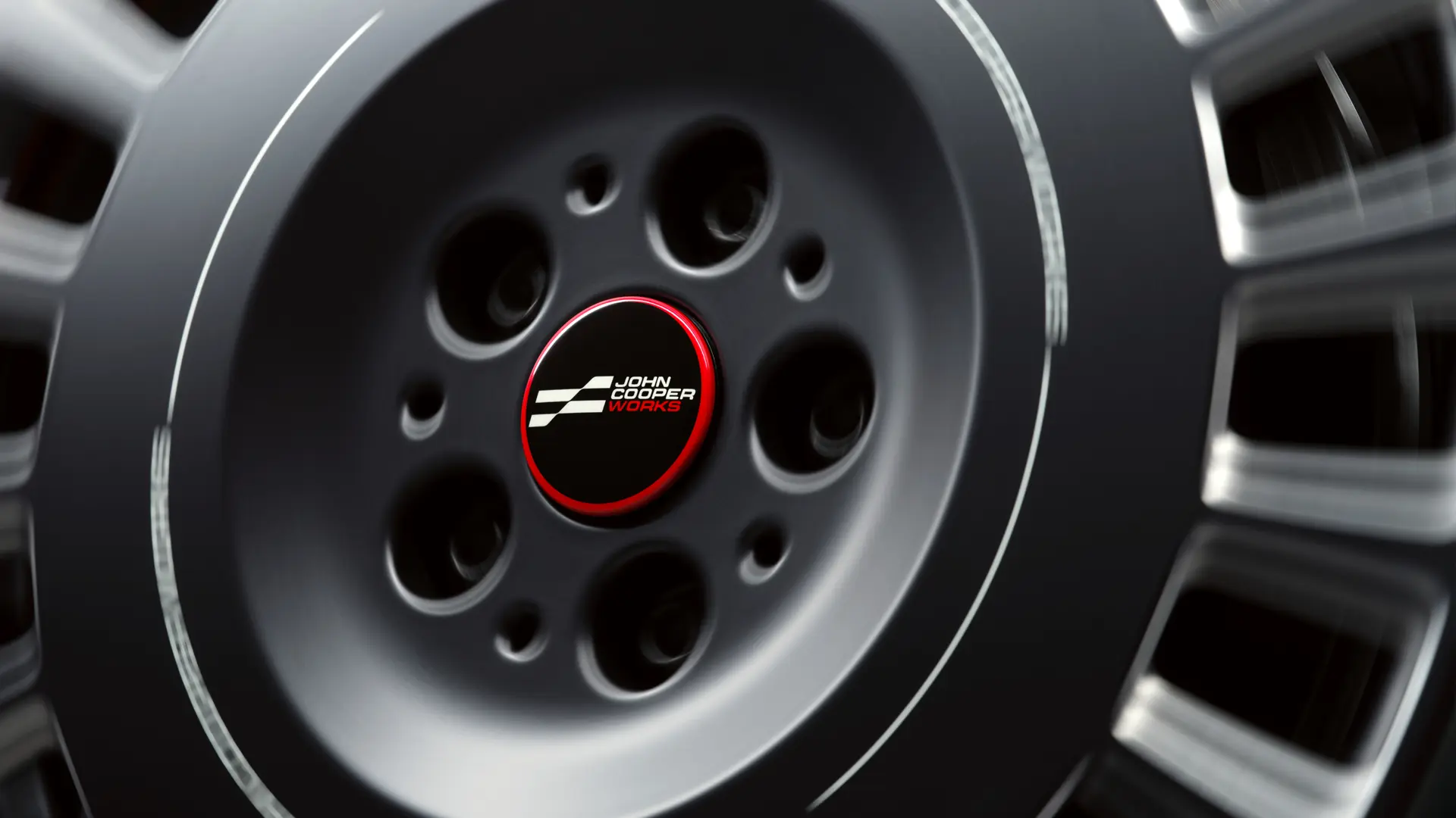 John Cooper Works plávajúci kryt náboja kolesa, ktorý sa neotáča spolu s kolesom, ale počas jazdy zostáva vo vodorovnej polohe. 